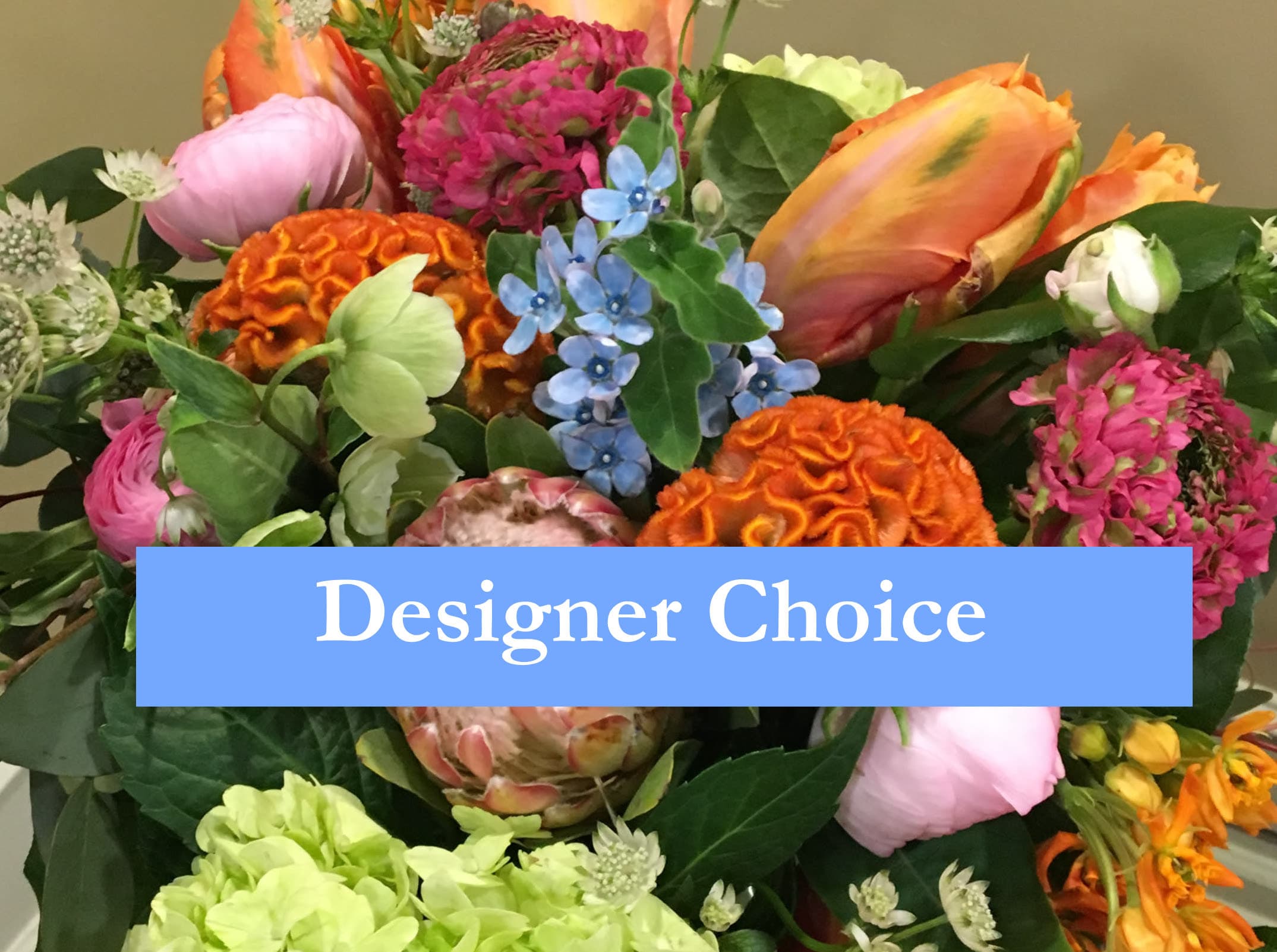 Designer's Choice - Let our designers create a beautiful arrangement with the freshest Flowers of the season! The pictured  flower arrangement does not reflect the specific content not color scheme of this arrangement as collection and design style choice are left to the designer's discretion.
