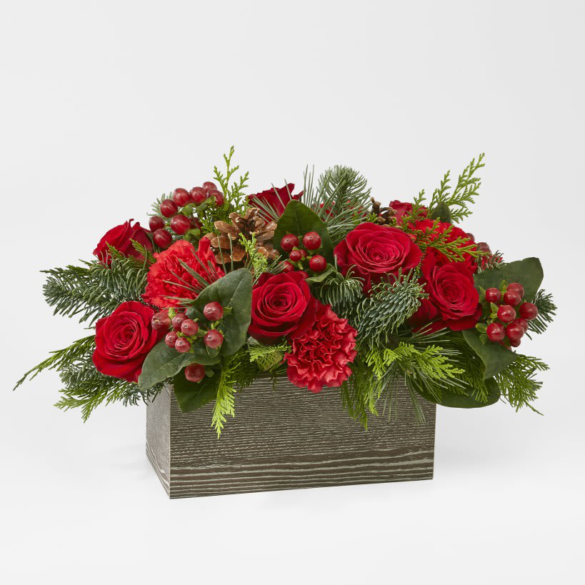 Together at Christmas (DB) - Luscious blooms are set in a weathered, wooden box, making it a gorgeous gift for someone who loves gardening or natural décor. Roses, Carnations and Hypericum berries. Available for same day delivery