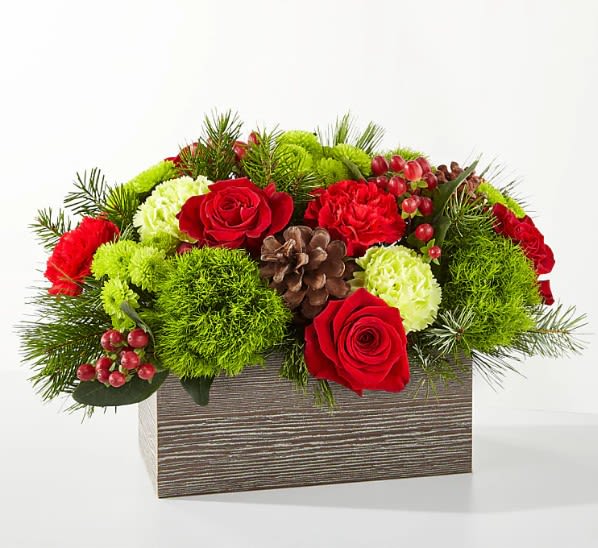 Bundled Up Bouquet - Filled with the essence of warmth and coziness, the Bundled Up Bouquet is the perfect gift for a loved one or centerpiece for your own holiday gathering. Standard picture shown is approximately 11&quot;H x 15&quot;W.