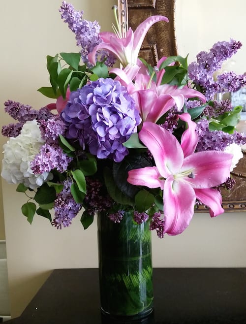 Fragrant Lilies  - Lovely blossoms of fragrant lilies accented by hydrangeas and few other interesting elements create this beautiful garden collection. Upgrade to make a lasting impression. 
