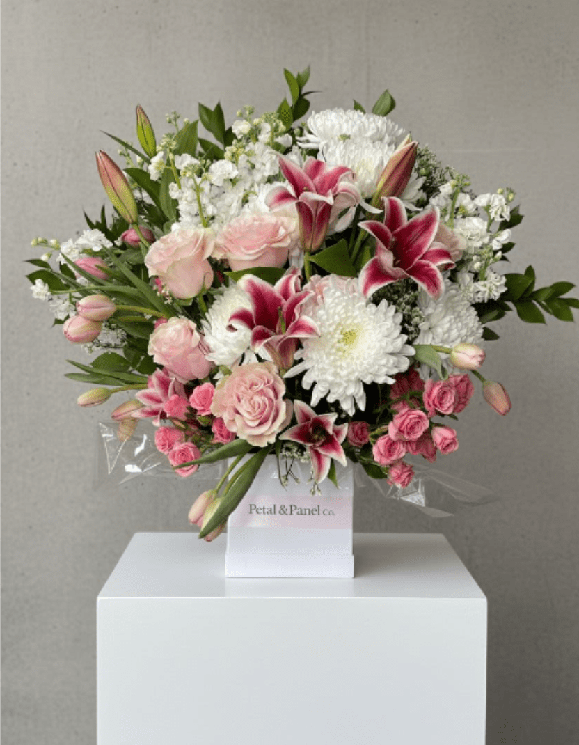 Harmony - This pink and white funeral basket is a lovely sendoff and tribute. Fitting for any type of ceremony. 