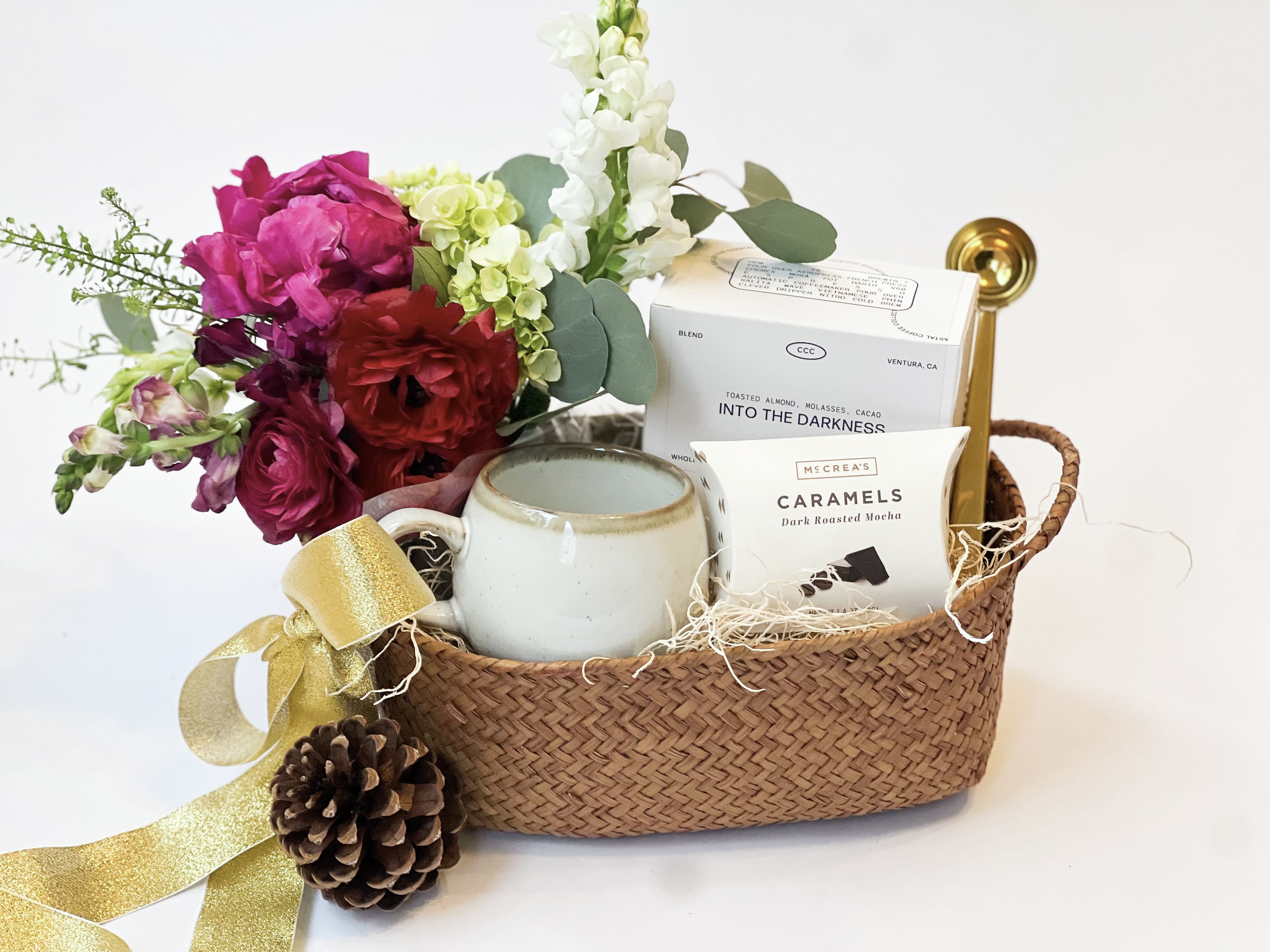 Holiday Coffee Gift Basket  - Give the gift of Coffee and Flowers with this gift bundle.   Curated Gift includes: -A petite seasonal floral arrangement - Whole bean coffee - Glazed Mug  - Mocha Caramels  -Gold Coffee Scoop  - Basket  - Hand written card   