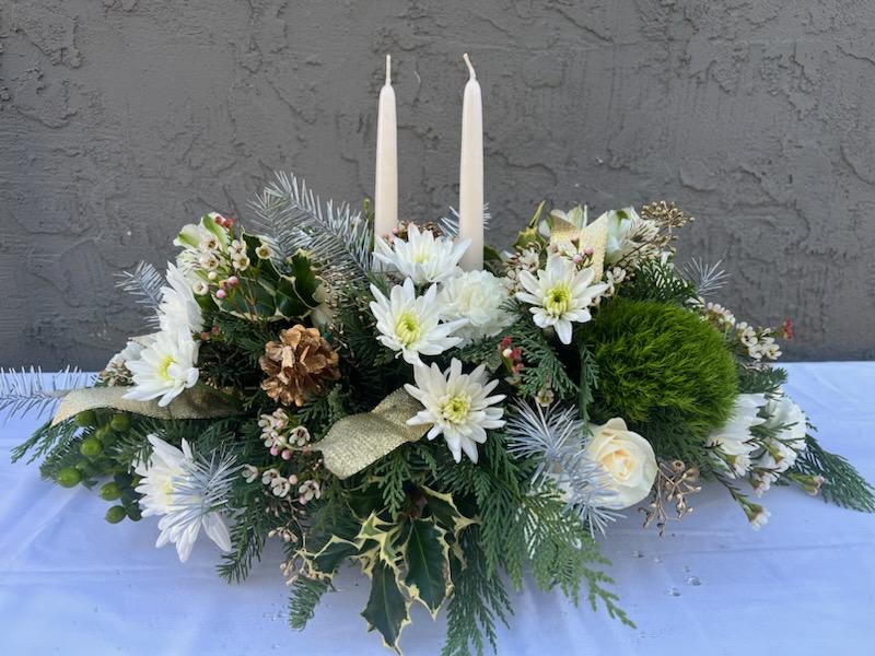 Carousel Winter Centerpiece - A centerpiece for the dinner table, with winter elements. White ribbon, white candles, pine cones.
