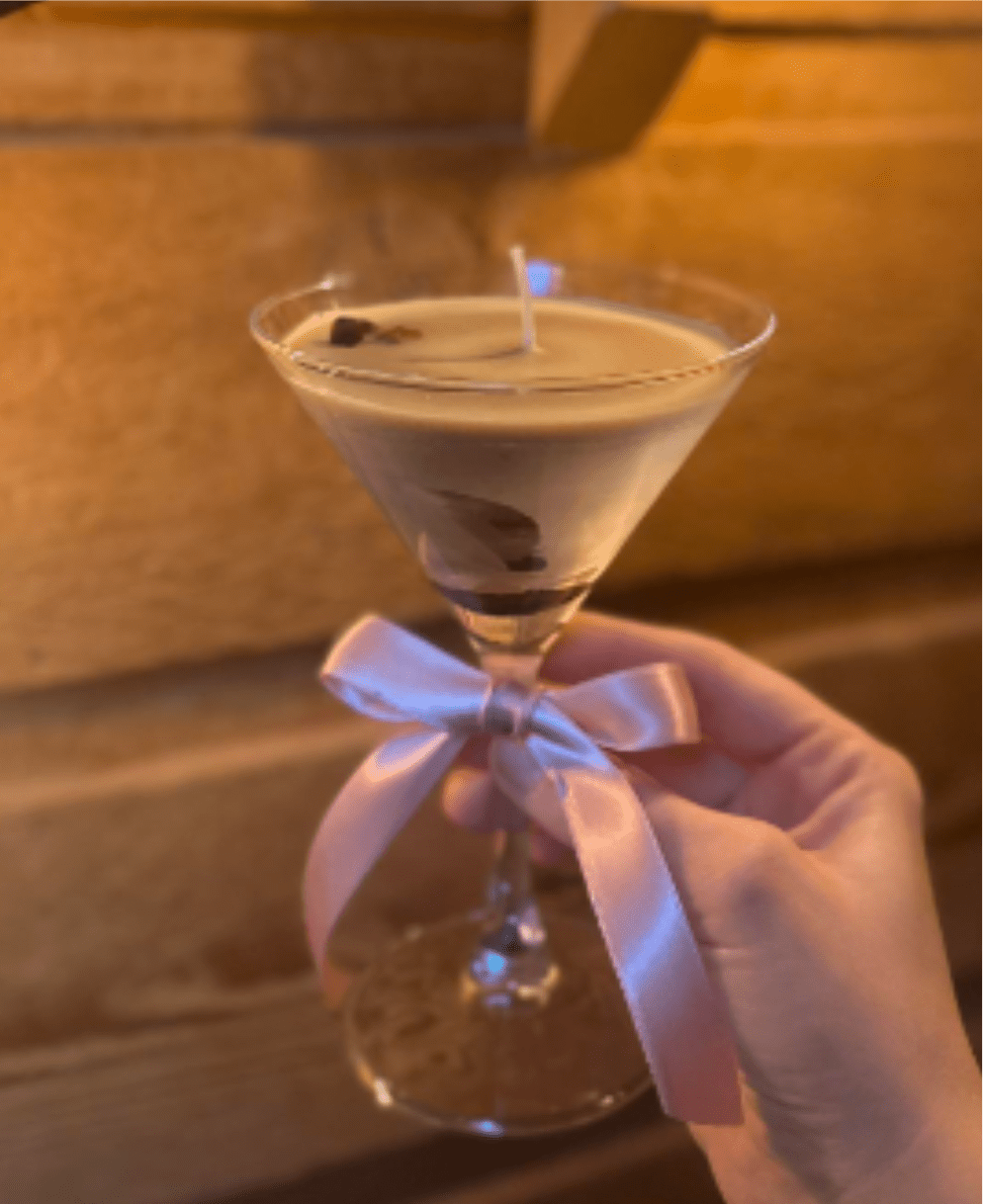 Espresso Martini Candle - A delectable scented candle in a cozy martini glass with a colored ribbon 