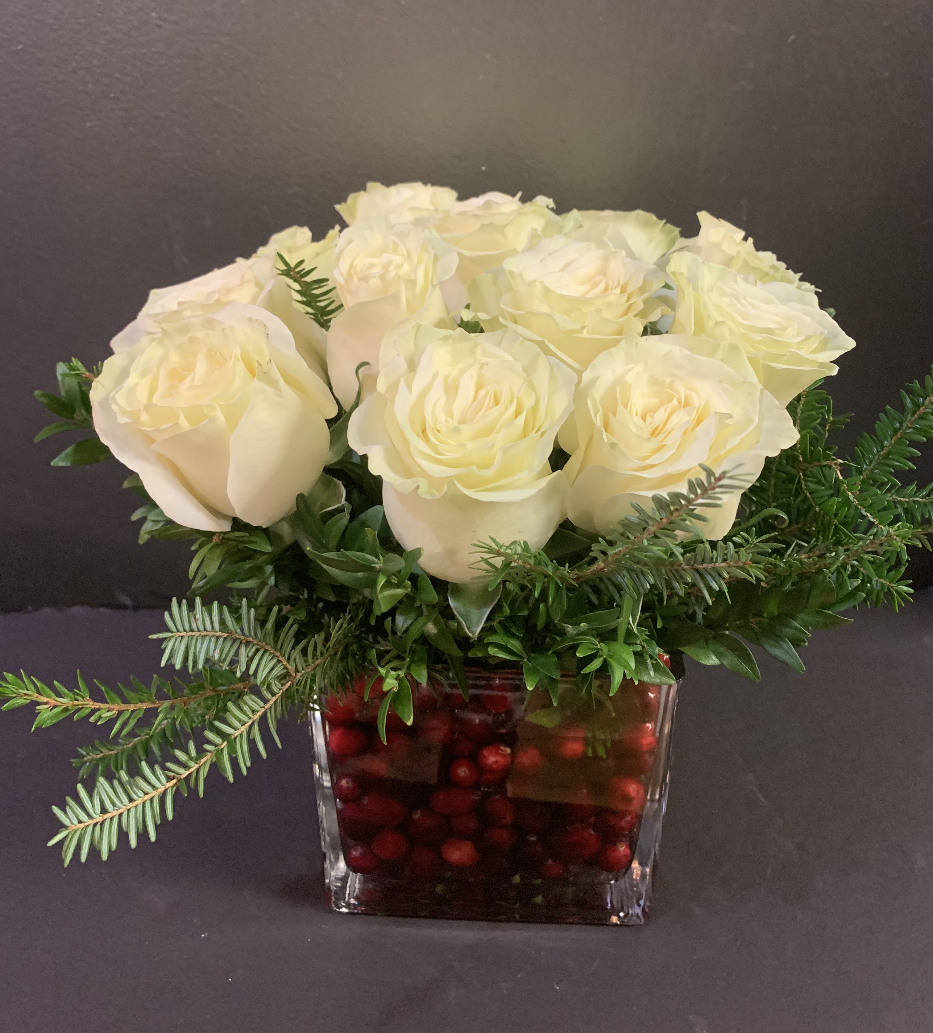 Holiday Secrets - Beautiful white roses will pop against the vase filled with red cranberries. 