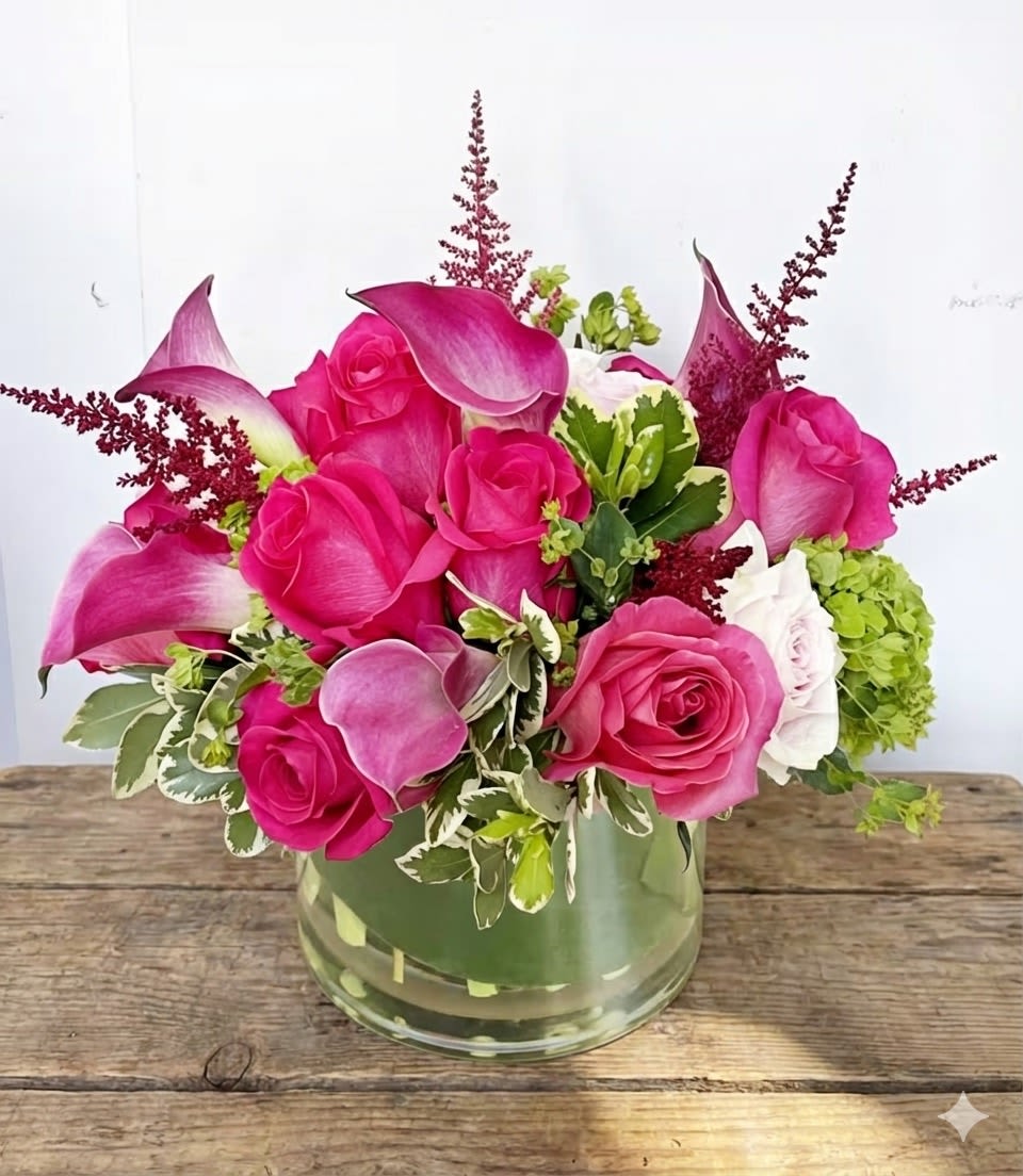 Hey Barbie - This pink arrangement features hot pink and pastel pink roses, accented with pink calla lily, green hydrangeas and other pink filler flowers 