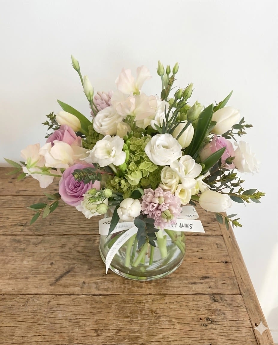 Pinky Day - This arrangement is presented in 5.5 pinched clear glass vase. This arrangement include include some beautiful spring mix, like pink sweet peas, pink hyacinth, white tulip, white freesia... 