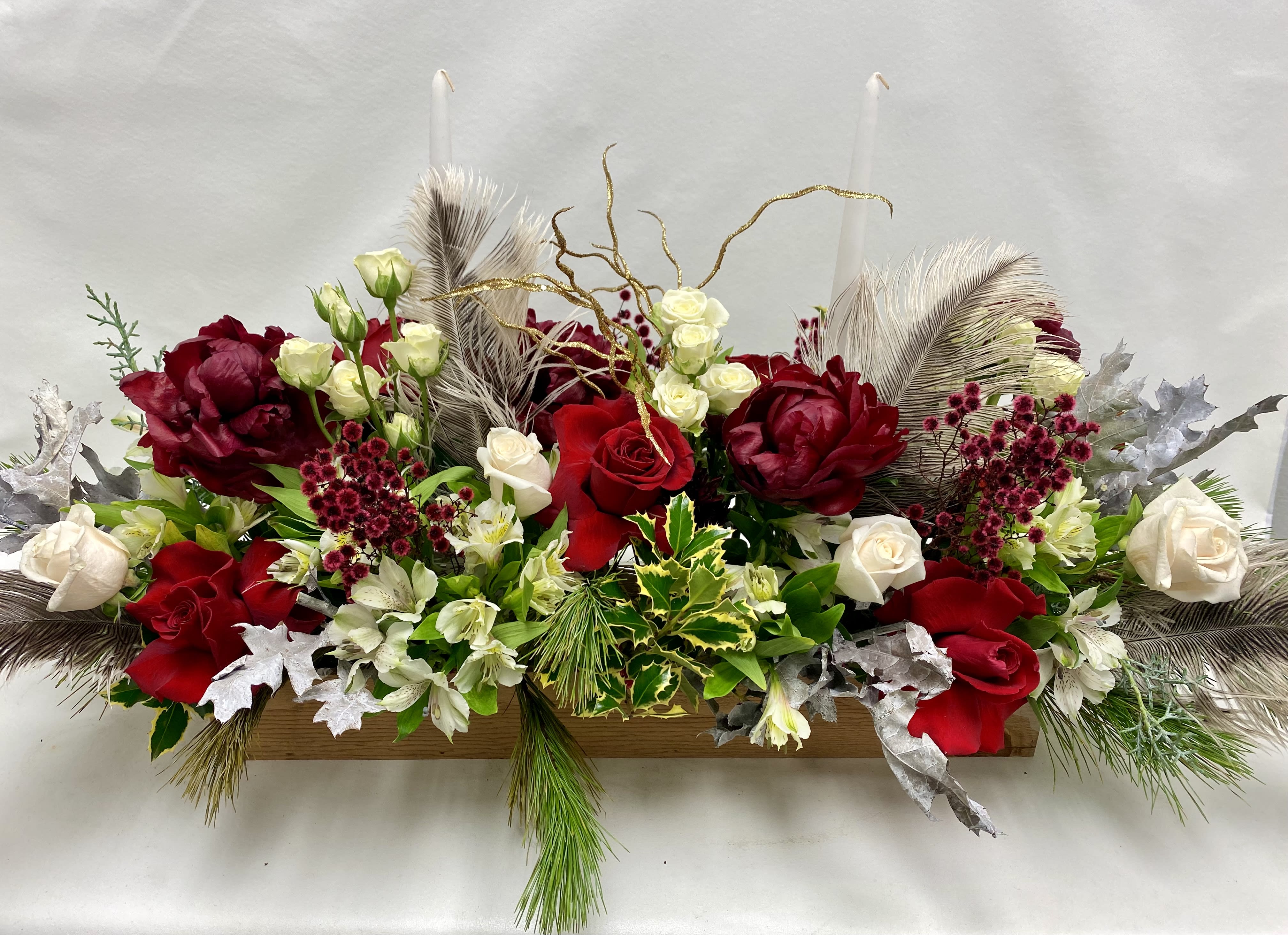 24״ Peonies Christmas Centerpiece  - Long 24” wooden box with peonies, roses, spray roses, alstroemerias etc. holiday greenery and 2 tall candles.