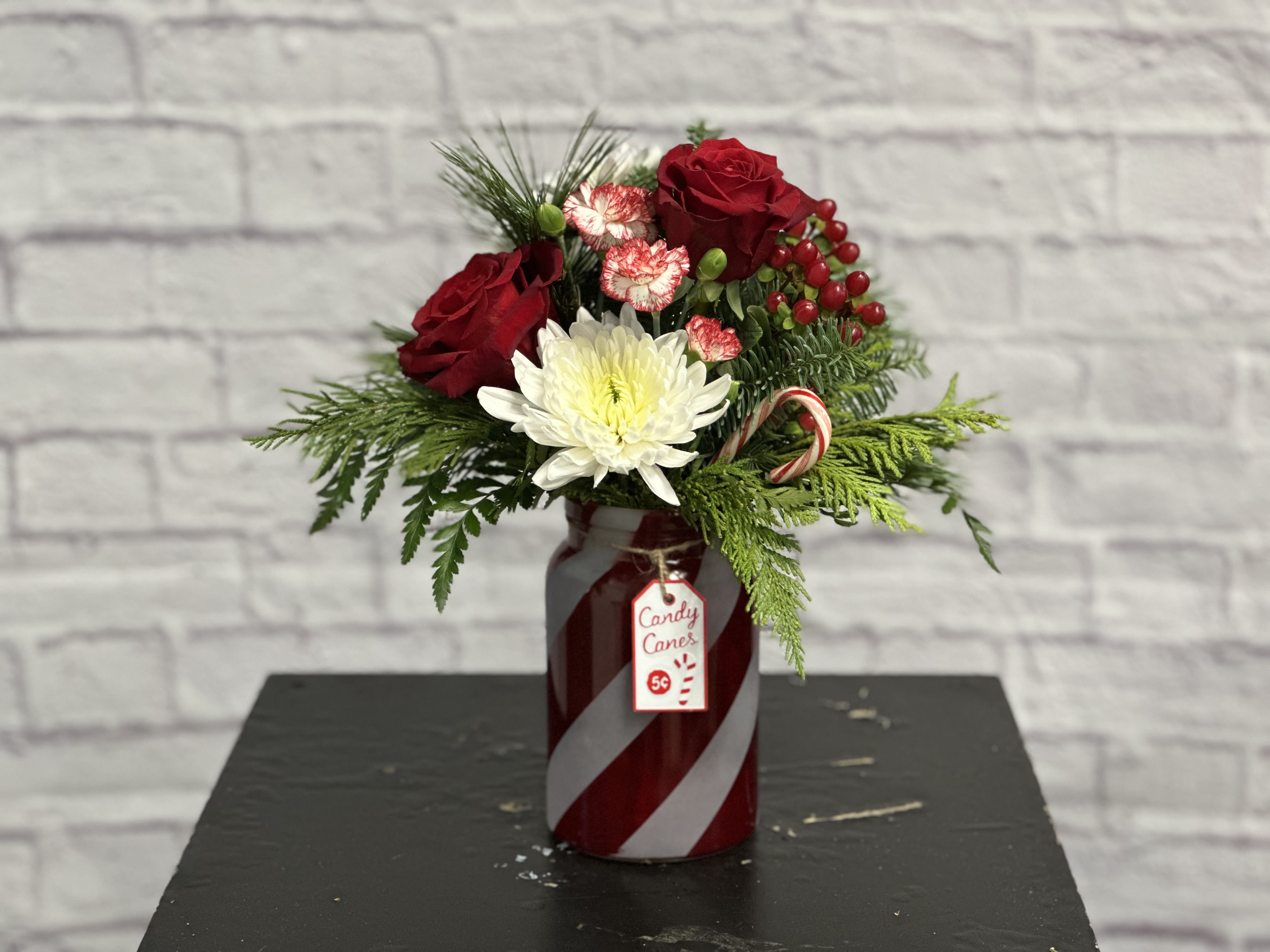 Peppermint Wishes - Bright and cheerful bouquet in Christmas reds, greens and whites - with a candy cane added!