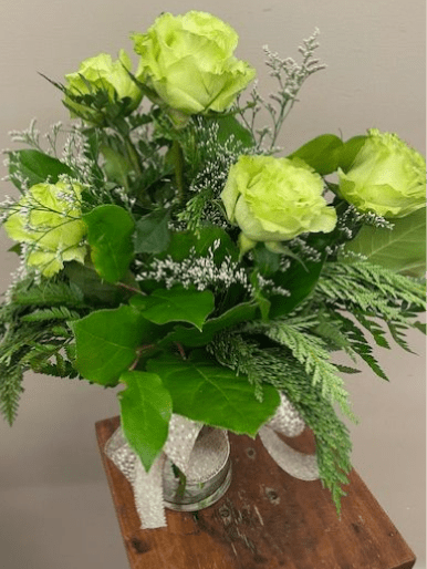 Winter Lemonade - Looking for some unique roses for winter? How about these &quot;Lemonade&quot; roses! 6 lime green roses with a ruffled petal and sprigs of fragrant winter greenery will send a statement of Wow!  