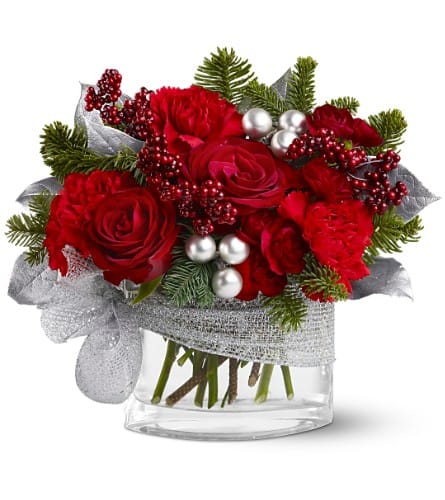 Silver Linings -      Someone will count their blessings this holiday season when they receive this precious mix of red roses, carnations, faux berries and silver ornaments, all tied up with a fancy silver ribbon.  Red roses and carnations and burgundy miniature carnations â accented with evergreens, silver-sprayed leaves, faux red berries and silver ornament balls â are delivered in a glass vase decorated with a silver ribbon. Approximately 10" (W) x 9" (H) 