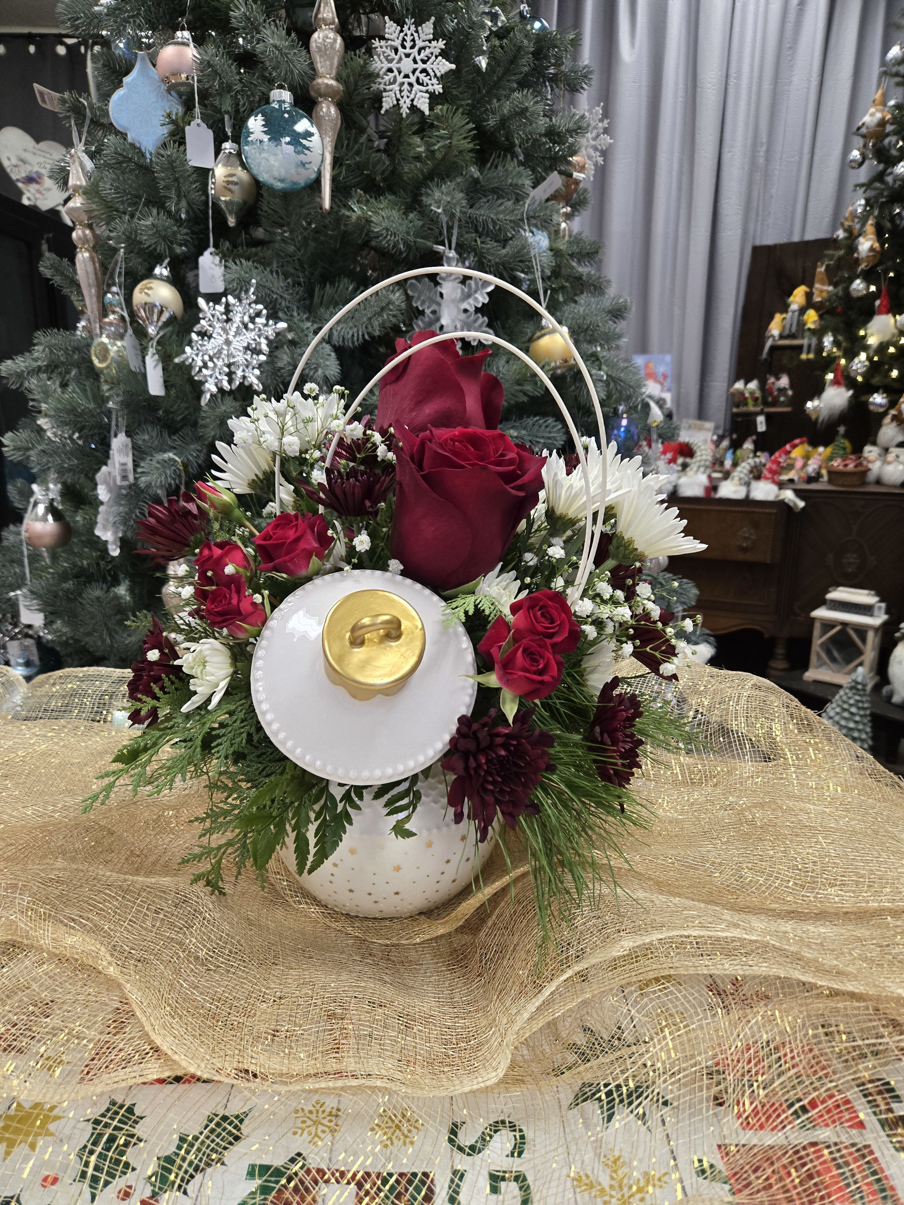 Christmas Ball Arrangment  - White Christmas ball trimmed in gold, filled with Christmas pines and red and White flowers.