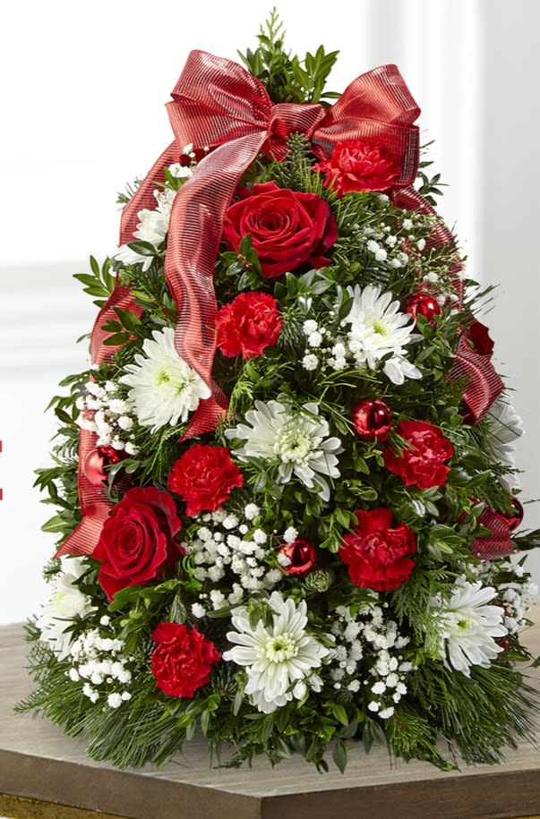 Christmas Tree  - Xmas tree is made of fresh cut Christmas greens combined with white cushions, red mini carnation and baby breath.Product size is 18&quot;H x 11&quot;W.
