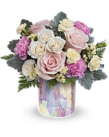 Rosy Quartz Bouquet - Sweet as a kiss, Teleflora's Rosy Quartz Bouquet is a precious pink arrangement in an iridescent mosaic glass vase perfect for your next celebration! This arrangement includes pink roses, white spray roses, pink carnations, miniature light yellow carnations, light yellow sinuata statice, dusty miller and leatherleaf fern. This pastel bouquet is delivered in Teleflora's Radiantly Rosy Cylinder. Orientation: All-Around