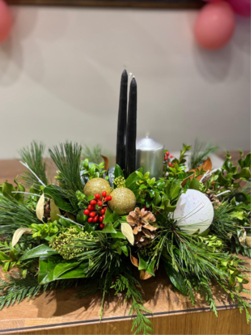 Winter 20 - Winter birch centerpiece -featuring  natural birch poles framed by fresh evergreen. 