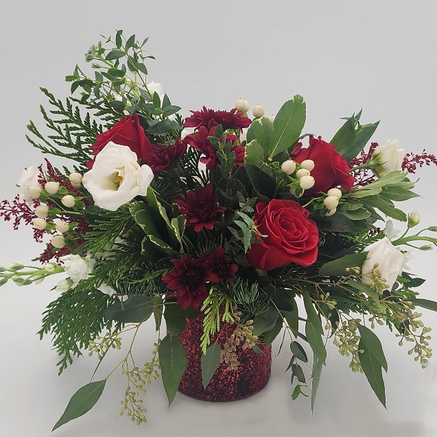 Holiday Sparkle by Lynn - Bring the holiday spirit into your home with Holiday Sparkle! With winter greens &amp; eucalyptus this arrangement stuns all the senses.