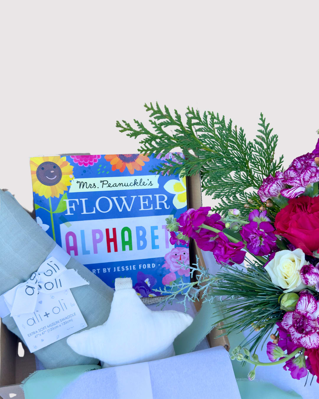 Winter Baby Bloom Gift Box | Newborn Gift Set with Seasonal Flowers + Baby Essentials | Deliberately Adopted × Afternoon Lark - Welcome the newest little one with our Winter Baby Bloom Gift Box, a beautifully curated newborn gift set featuring cozy baby essentials and our signature winter floral arrangement. Perfect for winter baby showers, holiday gifting, or welcoming a newborn with something meaningful and memorable.  This limited-edition seasonal baby gift box is created in collaboration with Afternoon Lark and includes thoughtfully selected items that new parents will love and use every day.  What’s Included ($100):  • Signature Winter Bloom Arrangement featuring seasonal winter flowers, soft textures, and lush greenery  • Ali + Oli Muslin Blanket, breathable and ultra-soft for year-round comfort  • Pacifier Holder and Clip, practical and modern for everyday use  • Baby Flower Book  Each Winter Baby Bloom Gift Box is hand-designed, beautifully wrapped, and ready for gifting. Available for local pickup or San Diego floral delivery.  This seasonal newborn gift box is an ideal choice for holiday baby gifts, new parent care packages, winter baby showers, or anyone looking for a unique baby gift that feels warm, intentional, and truly special.