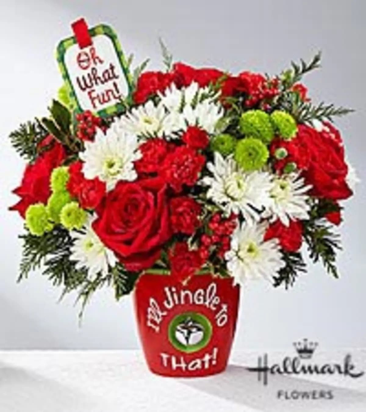 Christmas Jingle To That! - Red roses, and festive holiday flowers in an adorable keepsake ceramic with a Christmas Bell!