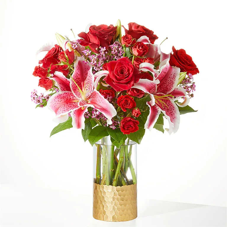 Match Made in Heaven Bouquet - Blooming red roses, exquisite lilies, and accents of spray roses are expertly designed by your local florist to remind that special person how loved they are.