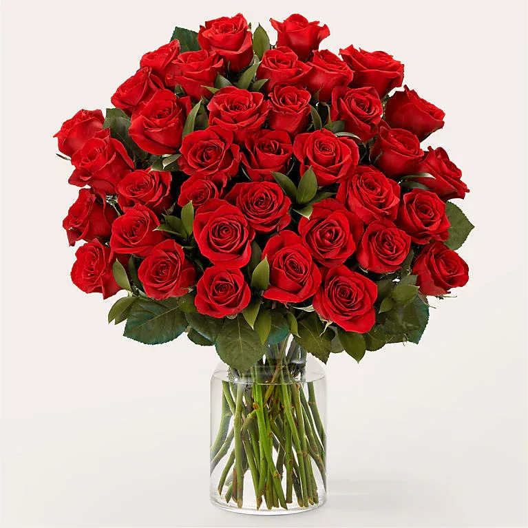 Three Dozen Long Stem Red Roses - Red roses are timeless, classic and iconic. Whether it's a romantic gesture or a meaningful gift to share how much you care, this bouquet of Three  dozen roses is bound to make your loved one swoon.