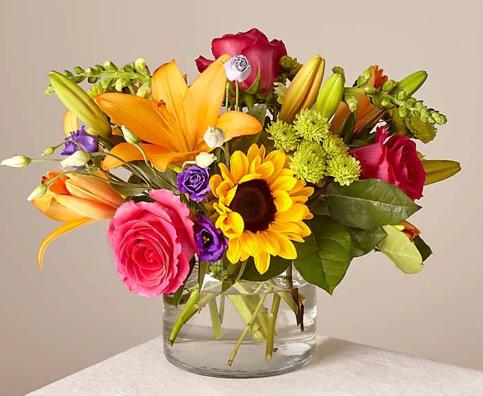 Best Day Bouquet - Make this day their best day. Our local florist handcraft a colorful array of flowers in a clear glass vase to create a celebration in bloom. Perfect to give for a special reason or to simply share a smile.