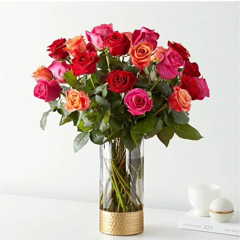 Ever After Rose Bouquet - Live happily with the Ever After Rose Bouquet. Celebrating Valentine's Day's favorite flower, this arrangement features three vibrant hues: orange, hot pink, and red. This trifecta will warm any space they're displayed in and any recipient’s heart...Standard: 18 Roses. Deluxe:24 Roses. Premium:36 Roses. 