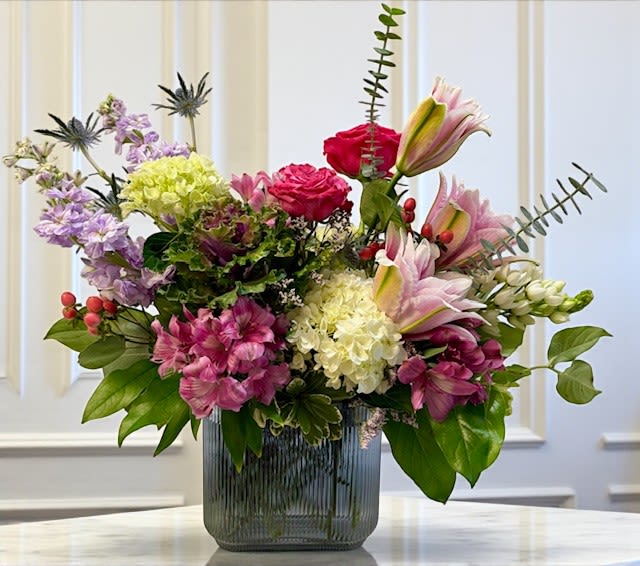 In Full Bloom Mode  - Vibrant, confident, and unapologetically beautiful — In Full Bloom Mode celebrates texture and form in a modern, feminine way. Designed in a sculptural glass vase, it’s a playful yet elegant statement piece that radiates joy, style, and sophistication.