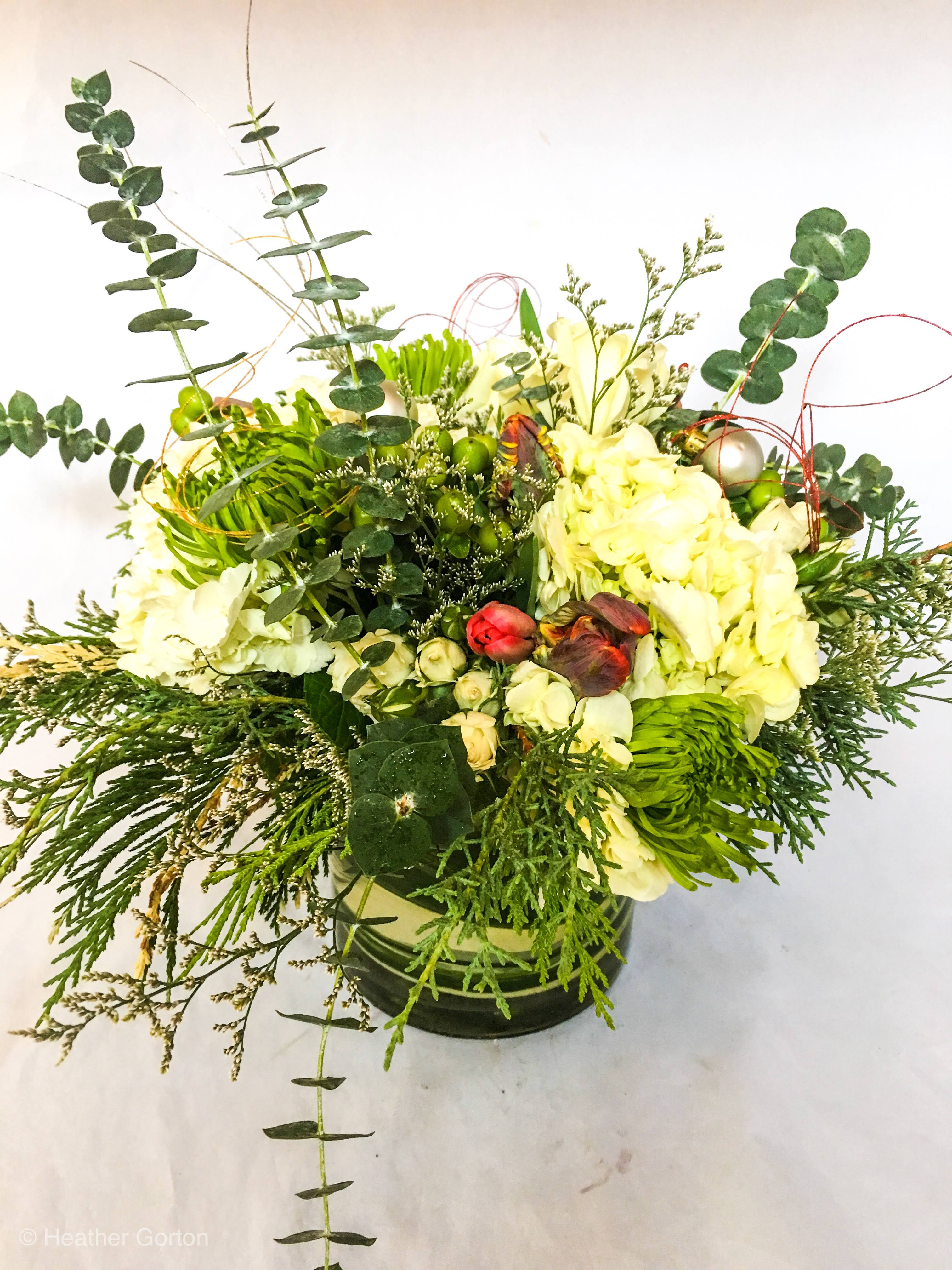 Everything Nice! - A super festive mix of hydrangea, spiral eucalyptus, giant chrysanthemums, and seasonal blooms adorned with ornaments and sparkle!