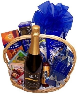 CHAMPAGNE &amp; GOURMET)NON-ALCOHOLIC GIFT BASKET - Ariel Cuvee Non Alcoholic Champagne stars. Alcohol is Out… Taste is In! in this basket of goodies.  Complete with Lindt chocolates, crackers, cheese spread, pistachios, summer sausage, cookies, cheese straws and marzipan candy.  Perfect for the non-drinkers in your life. Exact basket and gourmet selection may vary by season