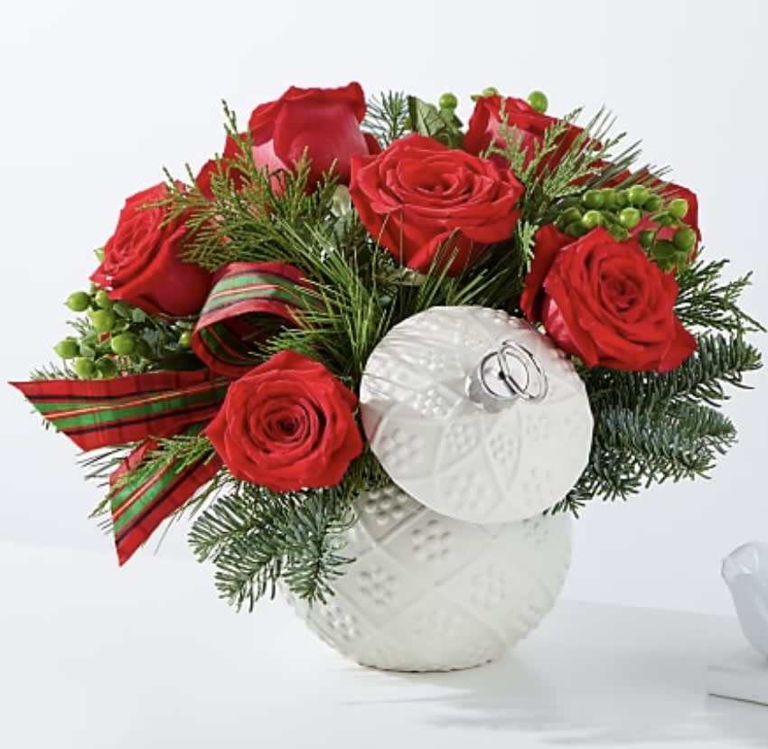 Trimming the Tree Bouquet - Bursting holiday spirit is elegantly symbolized in this deep red bouquet, where carnations, roses and berries explode from a keepsake ceramic ornament vase.