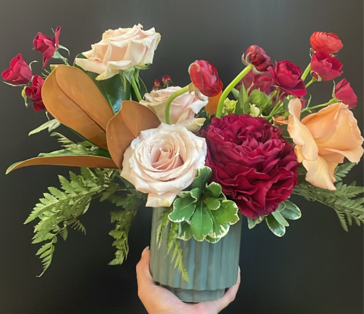 Cinnamon Spice - Sugar, spice, and everything nice! That’s what our holiday Cinnamon Spice arrangement will bring into your space. Featuring soft neutrals and bold burgundy florals along with assorted holiday greens. Perfect as a gift, or just something to get you in the holiday spirit. 