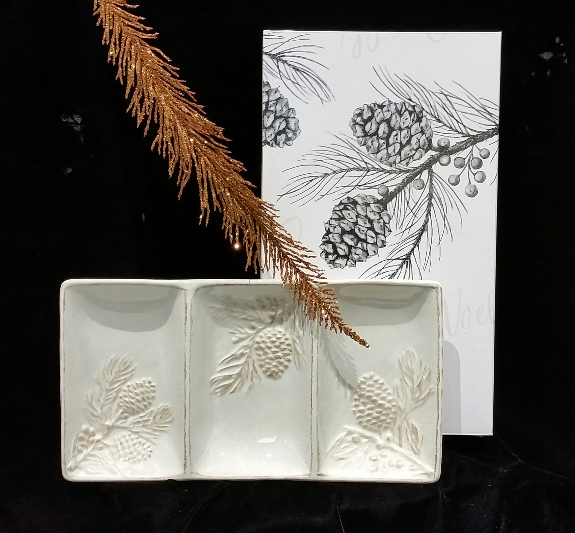 Pine Cone and Twig Ceramic Serving Platter - We have found a terrific company for holiday gift items.  This ivory ceramic hand-painted serving dish has a slightly raised holly pine and twig design. Add to your flour order or give just as it is.  Comes in its own attractive gift box.   1&quot; H x 9 3/4&quot; W x 9 3/4&quot; D. 