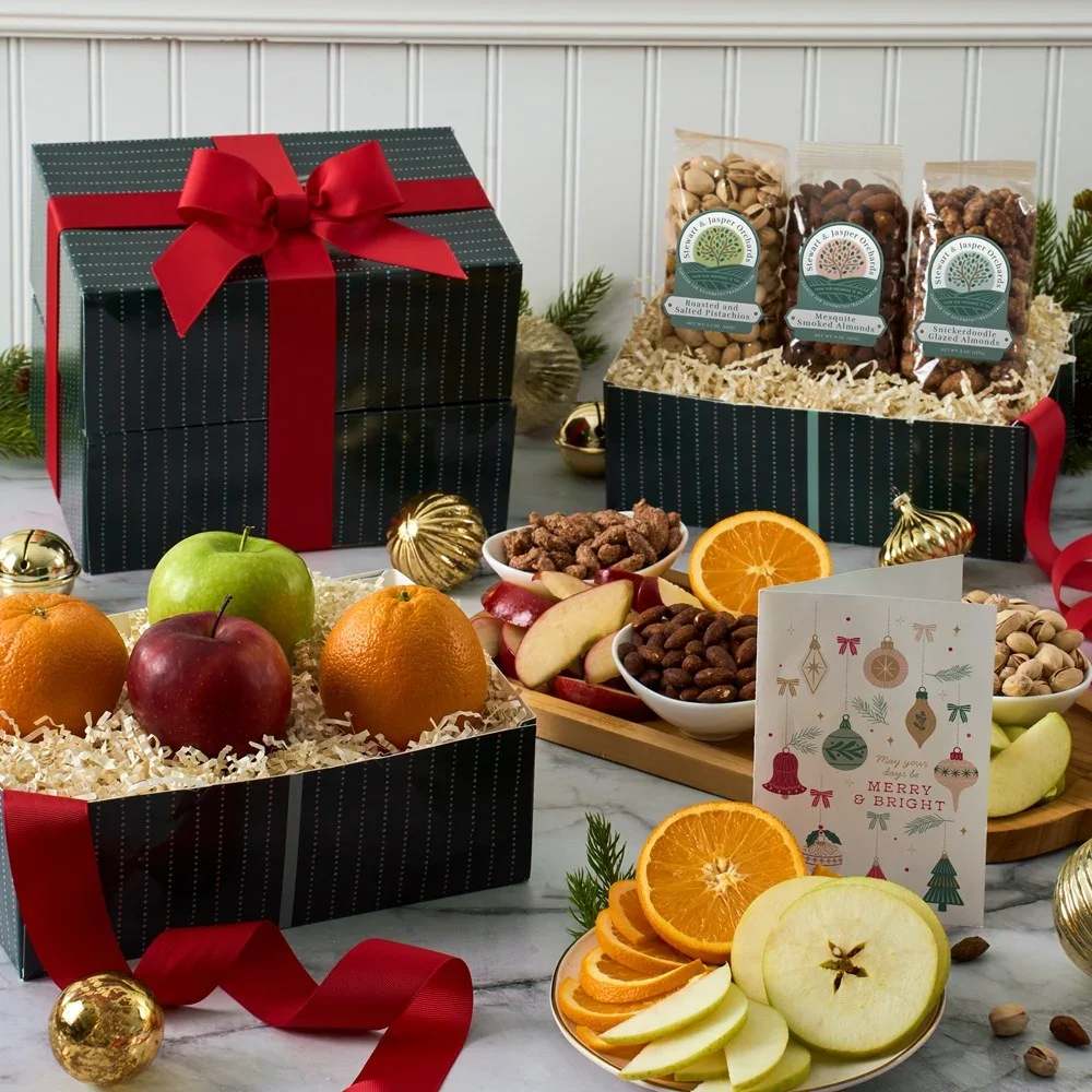 FRESH FRUIT AND NUTS HOLIDAY TOWER - Introducing the Fresh Fruit and Nuts Holiday Tower—a wholesome assortment of juicy fresh fruit, a variety of deliciously crunchy nuts with unique flavors. Imagine your loved ones enjoying each bite of the succulent fruit and the nuts' sweet and delicious crunch. This gift is perfect for nature lovers, health-conscious individuals, and anyone who enjoys the delightful flavors of natural gourmet foods. Give the gift of the Fresh Fruit and Nuts Gift Tower and celebrate life's simple pleasures with this thoughtful gift.  * Card shown not included, easily add it for a personal touch by selecting it as an optional add-on during checkout