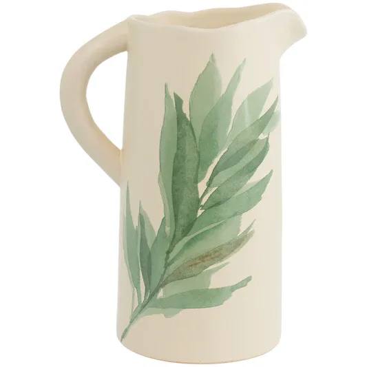Leaf and Stem Pitcher - Bring fresh, botanical elegance to the table with the Leaf And Stem Pitcher, a stoneware design brushed with painterly green leaves. Its sculpted handle and gentle, easy-pour spout make it a versatile piece for serving water or iced tea, and a serene centerpiece when not in use. Approximate dimensions are 8.5 x 6 x 12.25 inches.