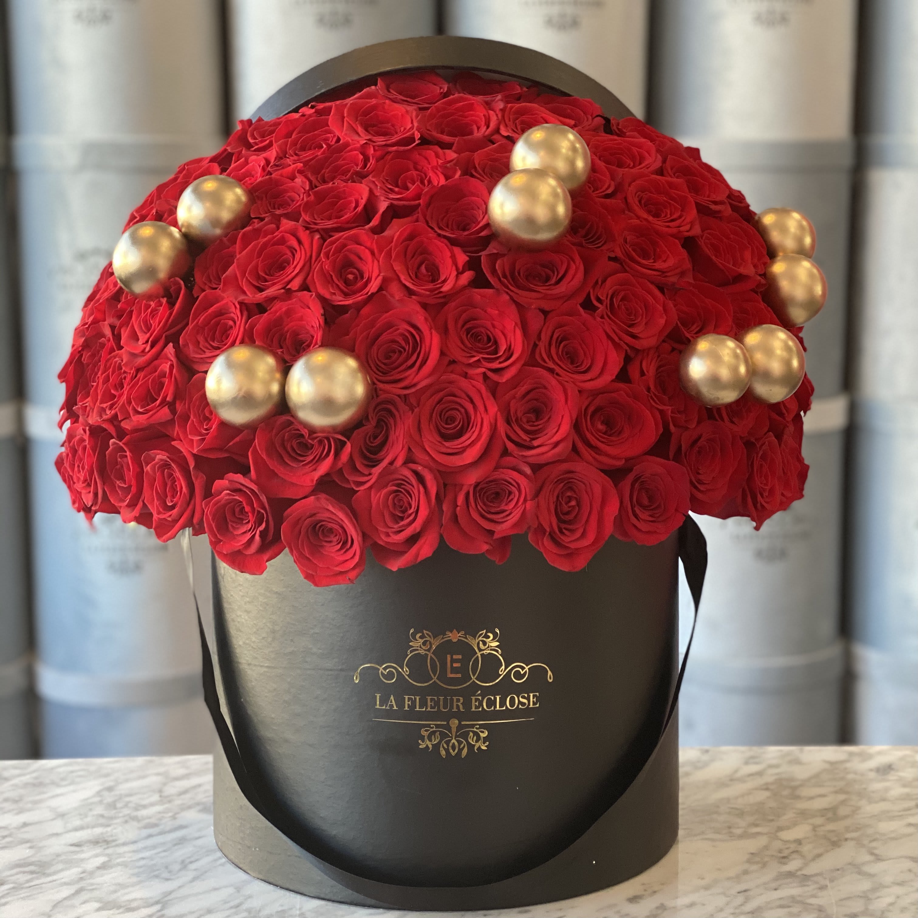 100 Rose Christmas  - Standard 100 red roses in our signature black box with Christmas Ornaments Deluxe 150 red roses in our signature black box with Christmas Ornaments Premium 200 red roses in our signature black box with Christmas Ornaments