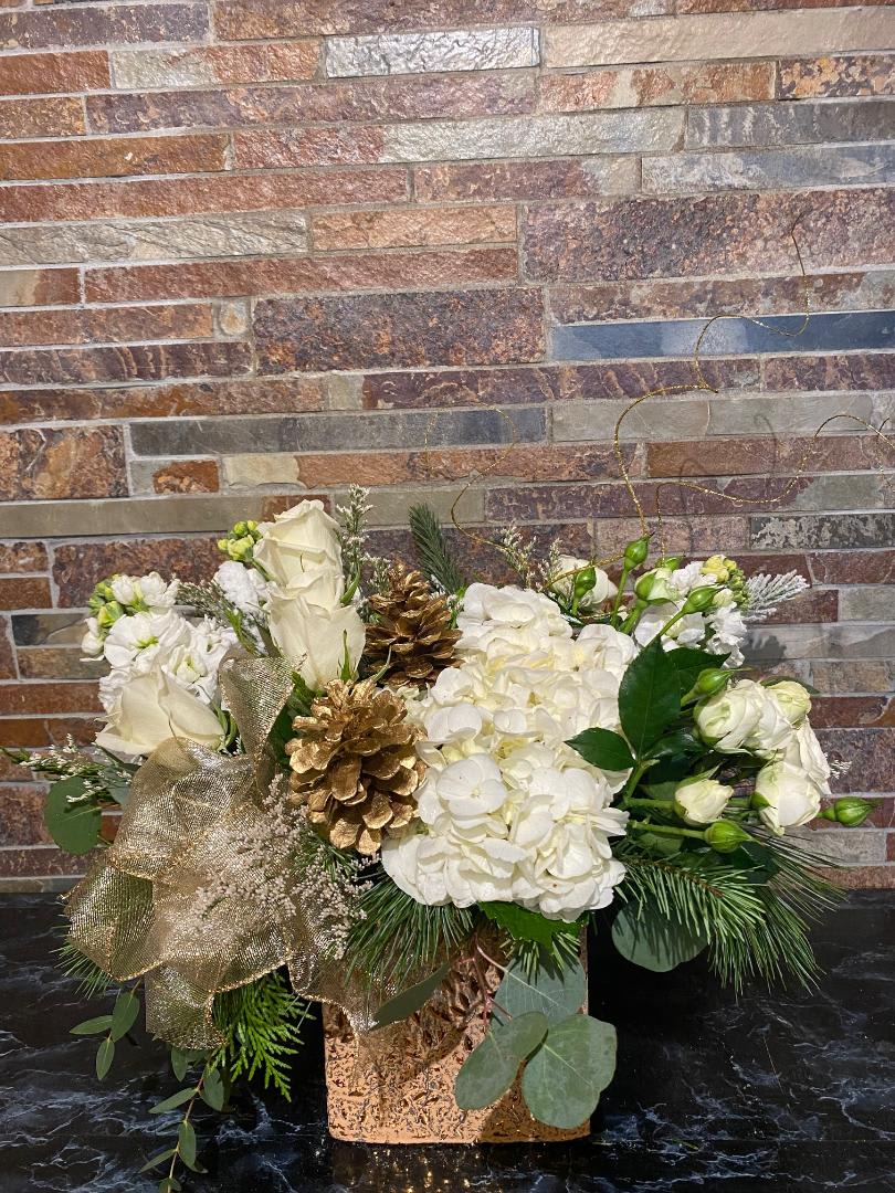 All that Glitters  - Our super sparkled gold leaf cube designed with beautiful white flowers and gold accents. Adds the perfect amount of glitz to your holiday decor. 