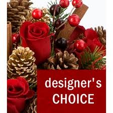 Christmas Designers Choice 85 - Let our expert florists work their magic with the Designer's Choice Christmas Arrangement and spread Christmas cheer this holiday season with flowers! Send the ones you love a beautiful gift of glad tidings and peace. As Santa’s little helpers, we’ll be sure to make them something that emulates the magic of Christmas. They’ll love receiving this gift, even if it’s not under the tree!  Crafted with the freshest flowers, this arrangement is a perfect seasonal design for Christmas. Trust us to create the ideal arrangement that captures the spirit of the holiday season, with our meticulous attention to detail and commitment to quality.  PLEASE NOTE: Designer's Choice product image does not necessarily reflect the finished item. This product consists of seasonal, market-fresh flowers, which will vary by the day. 