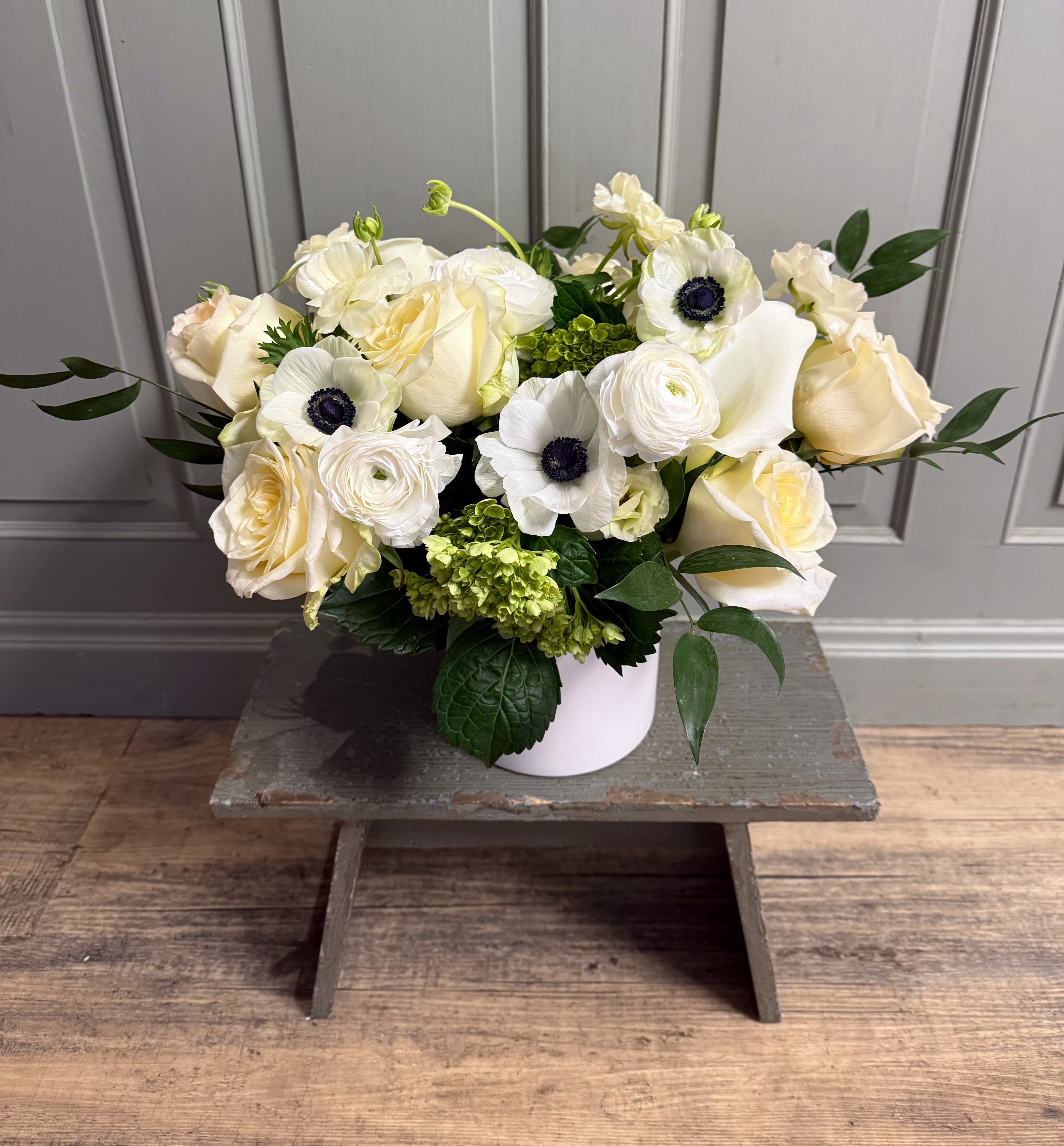 Winter Whites - A ceramic white cylinder with elegant white and green florals. Simplistic &amp; classy.