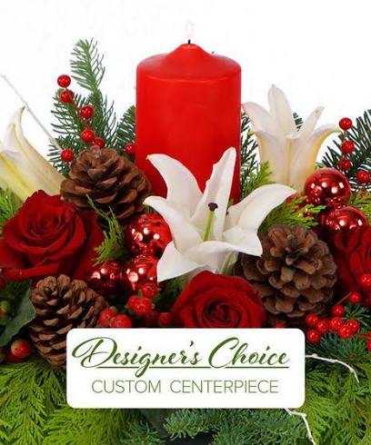 Designer’s choice Christmas Centerpiece  - Celebrate the season with a one-of-a-kind festive creation! Our Designer’s Choice Christmas Centerpiece is hand-crafted by our expert florists using the freshest blooms and seasonal greens available. Each arrangement is thoughtfully designed to bring warmth, elegance, and holiday magic to your table. Featuring a unique mix of premium flowers, lush evergreens, and charming Christmas accents, no two centerpieces are ever the same—each one is a beautiful surprise tailored to the spirit of the season. Perfect for holiday dinners, gift-giving, or adding a joyful glow to your home.