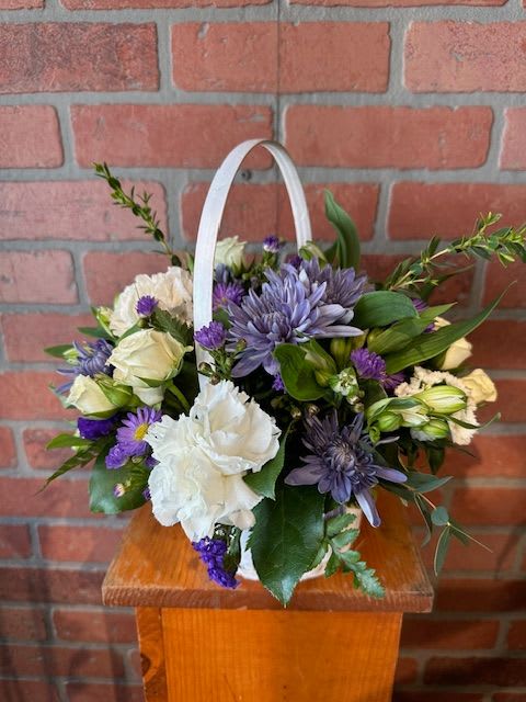 Winter's Harvest - A beautiful assortment of unusual natural blue and purple mums mixed with other white long lasting flowers.