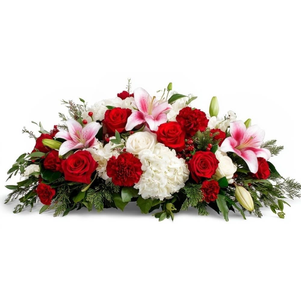 Holiday Radiance  - Celebrate the season in timeless elegance with this radiant Christmas centerpiece. Featuring festive red roses, snowy white hydrangea, crimson carnations, and stargazer lilies, this lush design brings warmth and joy to every holiday table. A beautiful expression of love, tradition, and cheer.