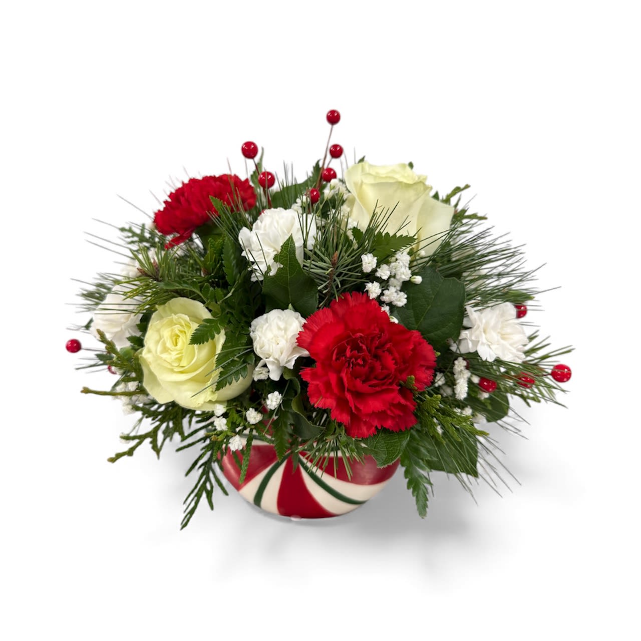 Peppermint Drop  - A beautiful compact holiday arrangement featuring red and white blooms nestled in winter greens and designed in a ceramic peppermint candy shaped container. 