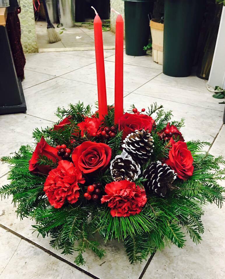 Christmas Center Piece - Please call (347) 492 - 5777 for variations and options. Available any size any price any flowers and can be done as a hand rappped bouquet or basket.