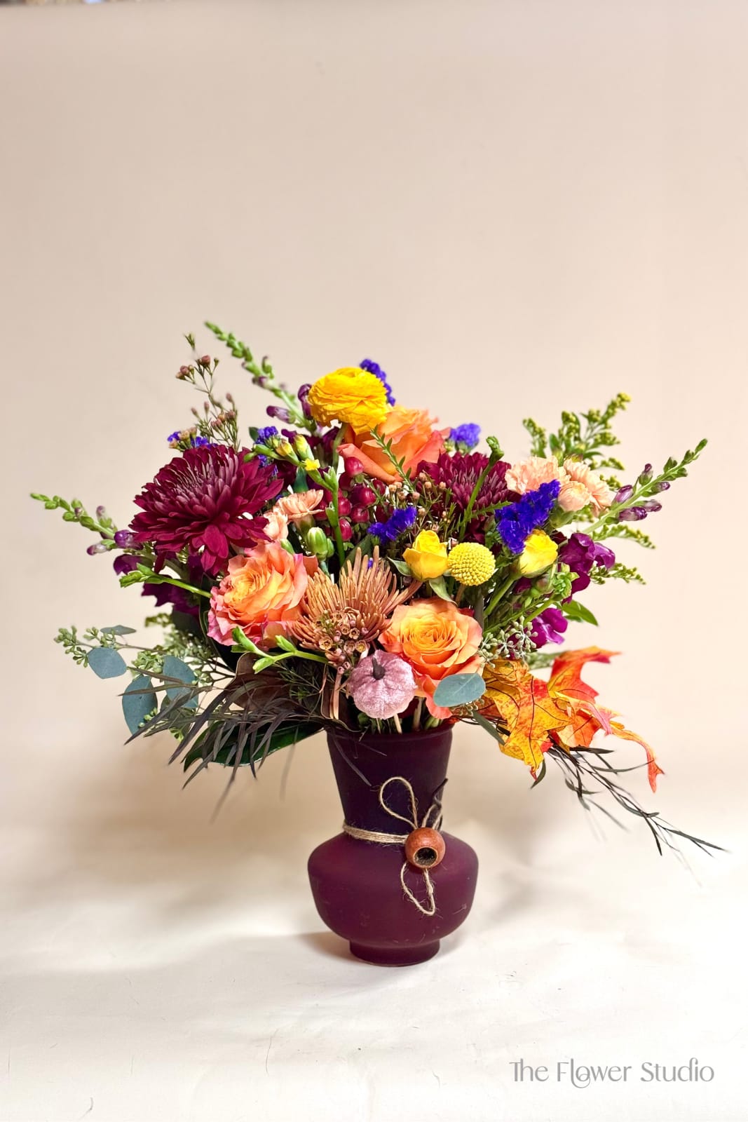 Harvest  - Harvest Bouquet, a stunning arrangement that brings the best of fall’s natural beauty indoors. Perfect for adding warmth to your home or gifting as a symbol of gratitude and abundance, this arrangement is tied together with a touch of twine and presented in a charming vase. Celebrate the beauty of the harvest season with every petal and leaf!  Our artists hand-design each arrangement, so Flowers &amp; Containers colors and style may vary due to local availability therefore we are unable to fulfill any requests for specific florals, colors, or containers/vessels.