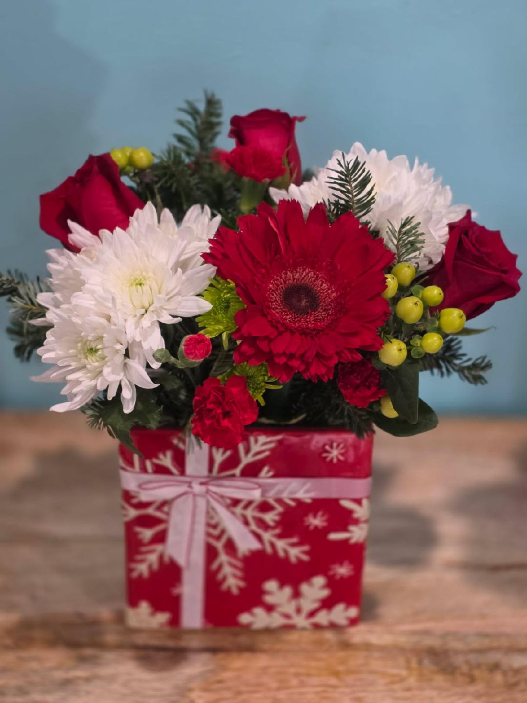 Joyful christmas gift - A beautifully designed arrangement in a Christmas gift container.