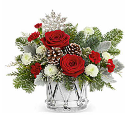 March Of Joy Bouquet - March of Joy Bouquet brings festive cheer with vibrant red blooms and frosted greenery, all arranged in this keepsake Crystal Drum Vase. A joyful addition to any holiday celebration.