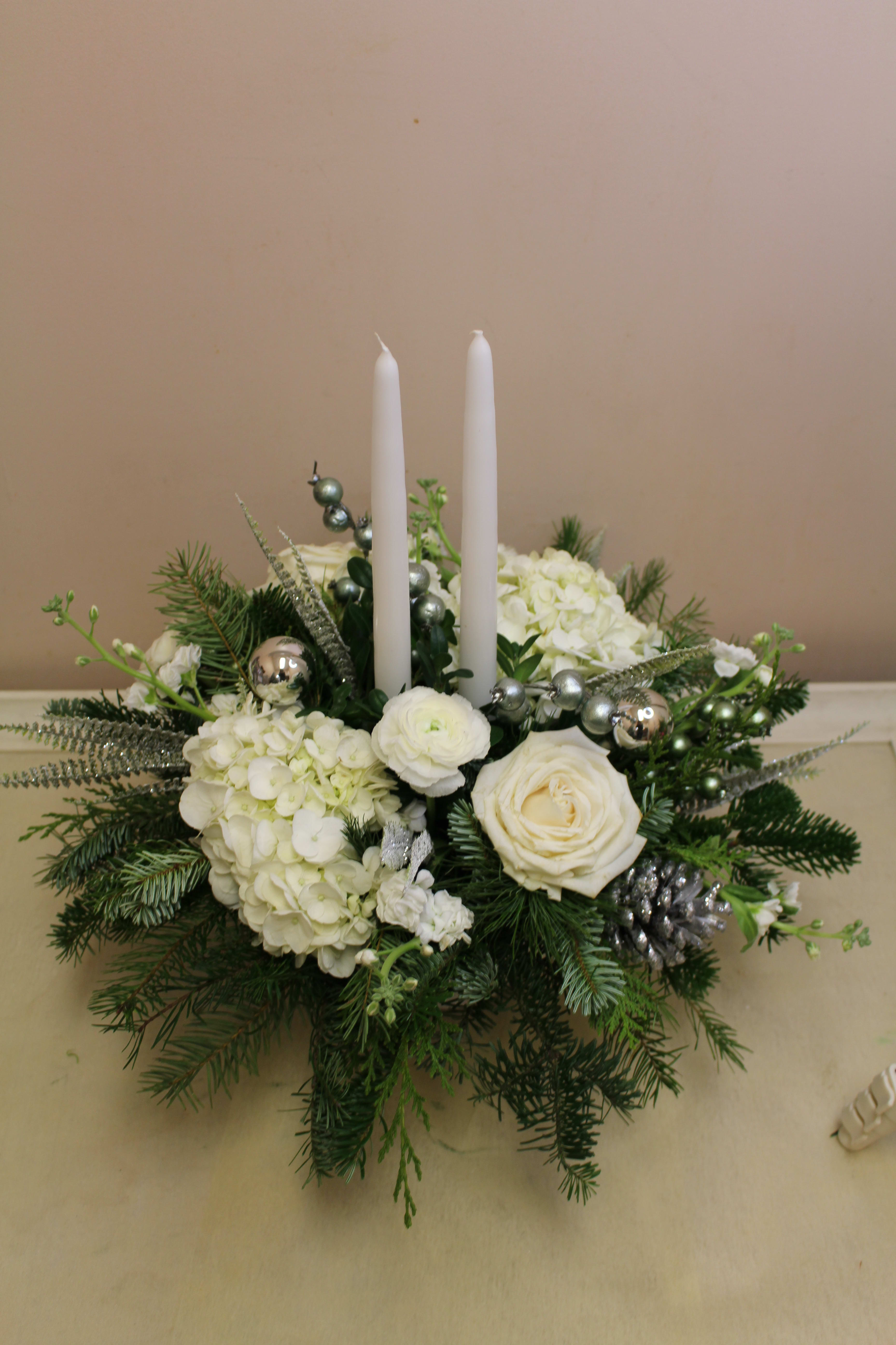 White Christmas - A white ceramic pedestal filled with white hydrangea roses and lisianthus 