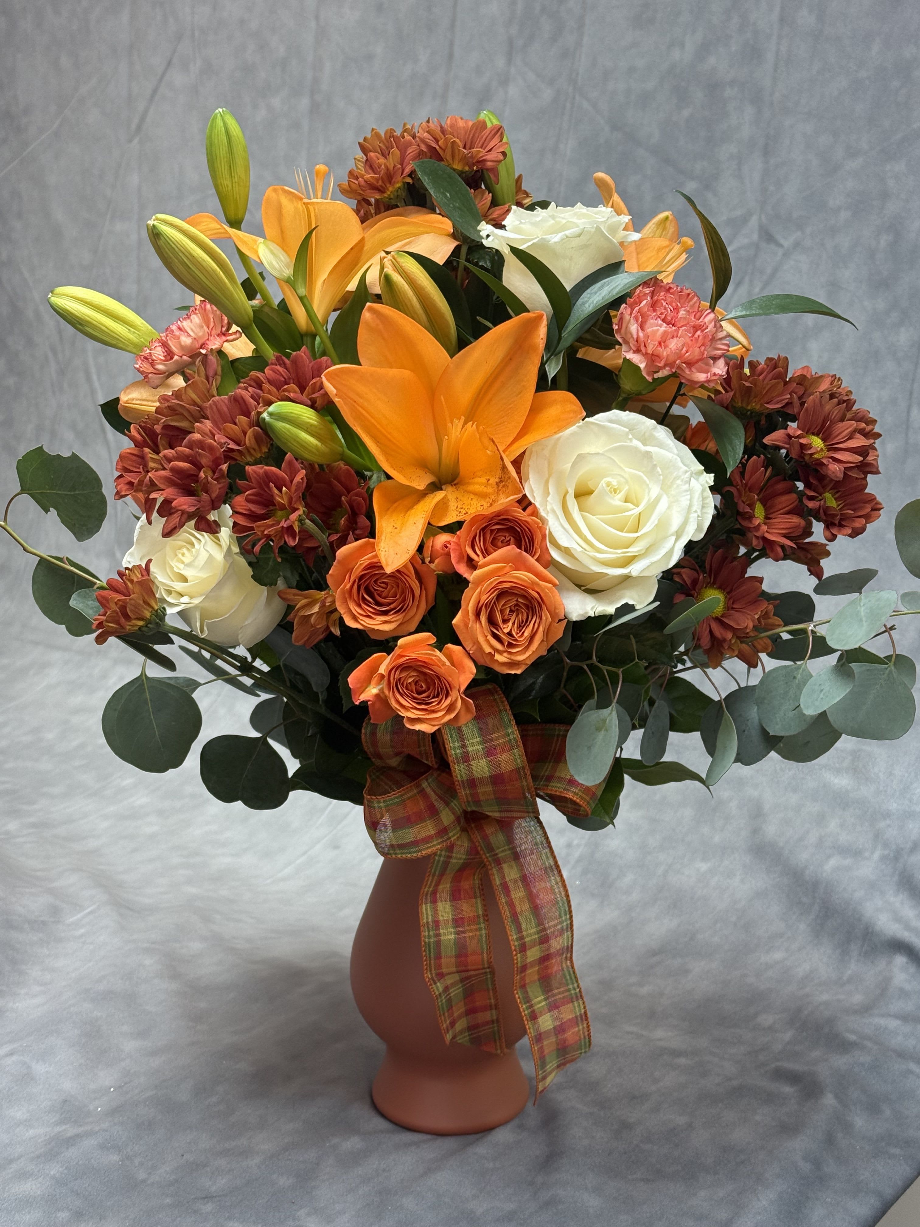 Fall Blossoms  - Embrace the beauty of fall with our exquisite fall Blossoms arrangement! Handcrafted with vibrant hues of fall colors, our arrangements capture the essence of the season. Celebrate your loved one with a special warm fall arrangement to brighten their day. 