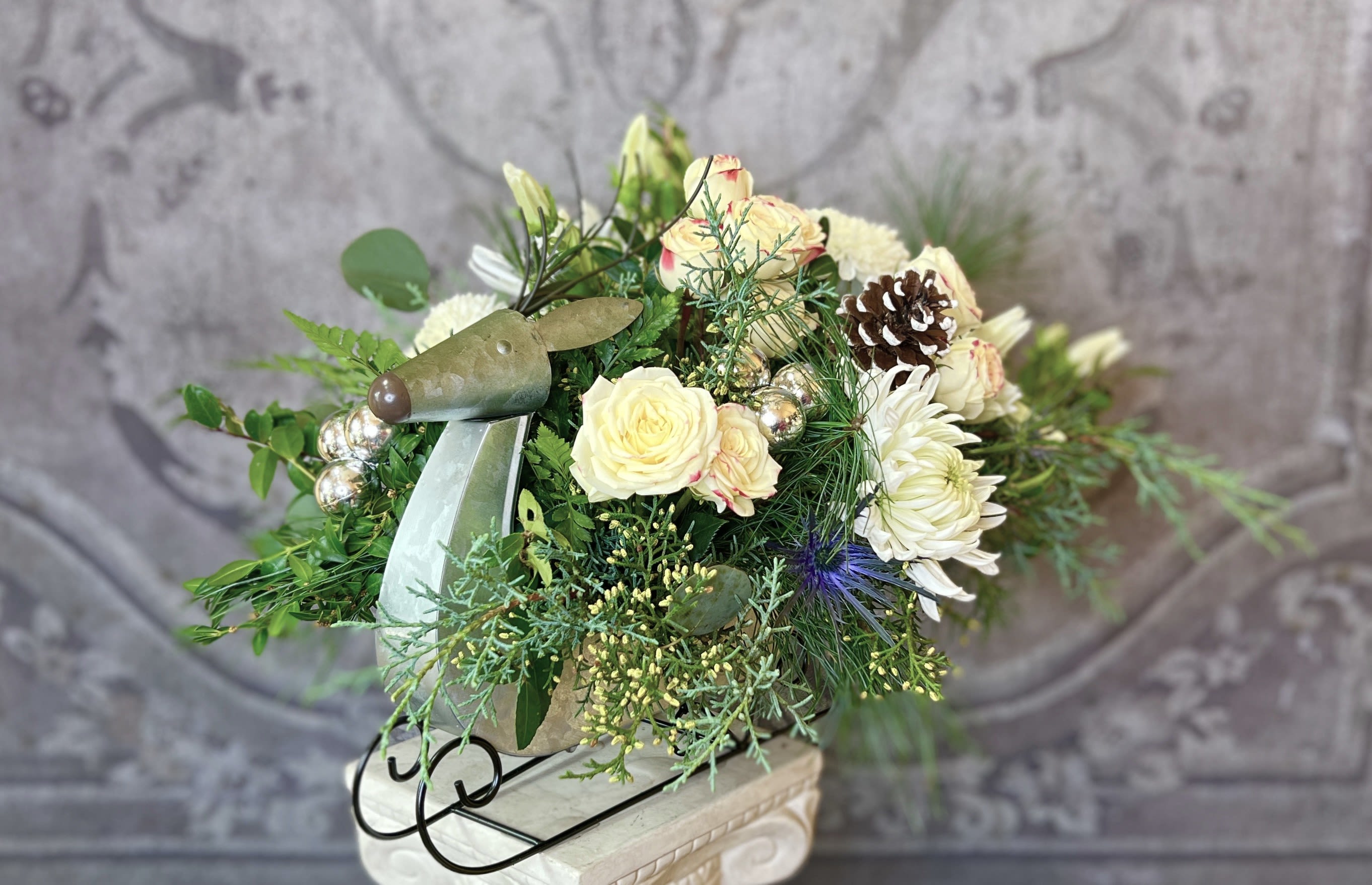 Rudolph's Sleigh - This beautiful arrangement in Green &amp; White comes in a cool Reindeer Sleigh!