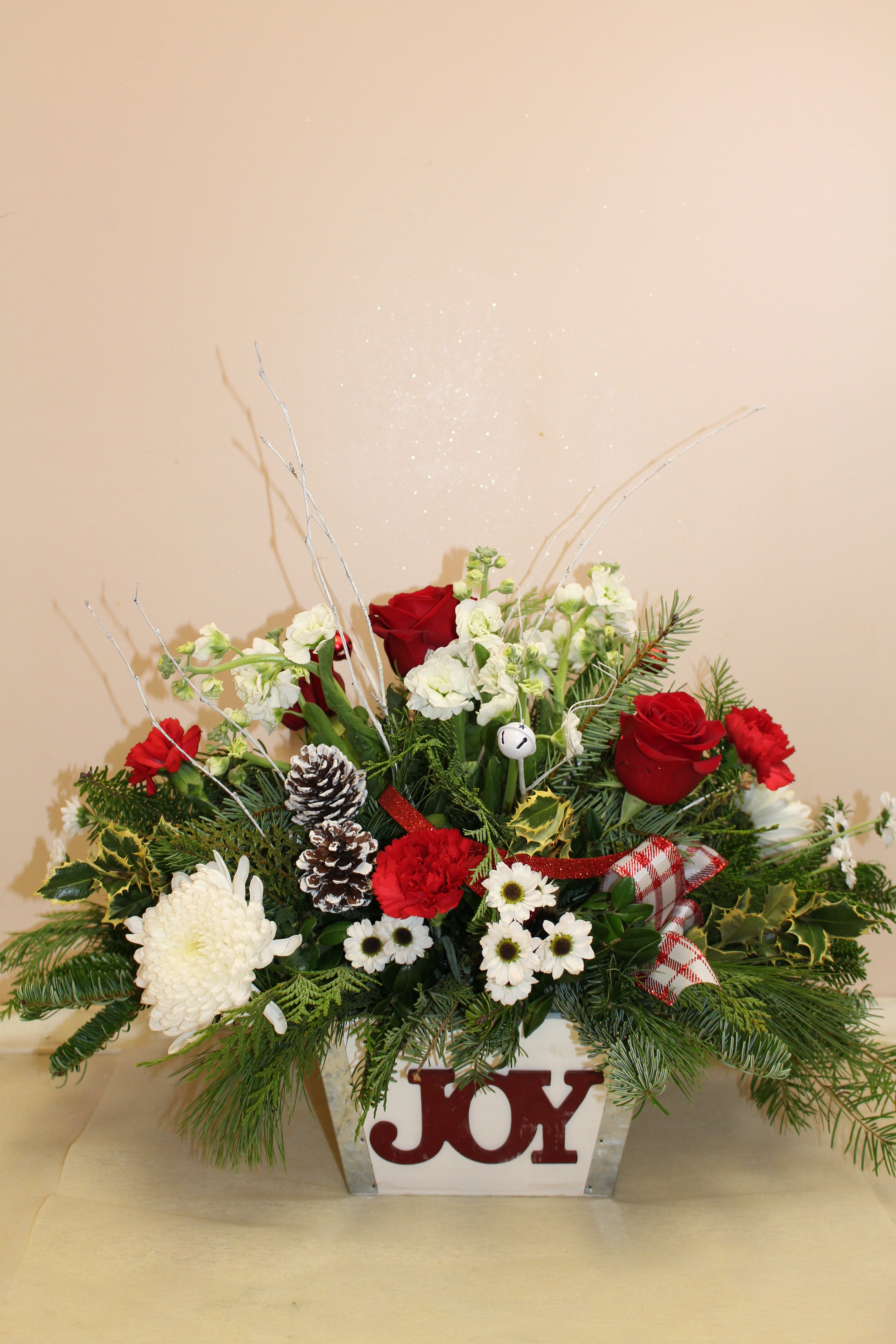 Joy to the world - Wooden box with "Joy" written across the box.  filled with holiday arrangement